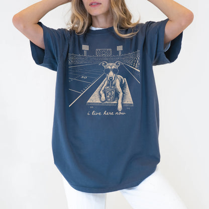 Model wearing a Denim Comfort Colors® T-shirt featuring Whippet ready for football and tailgate season