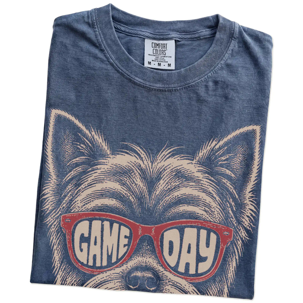 Folded Denim Comfort Colors® T-shirt showing yorkie wearing red game day sunglasses
