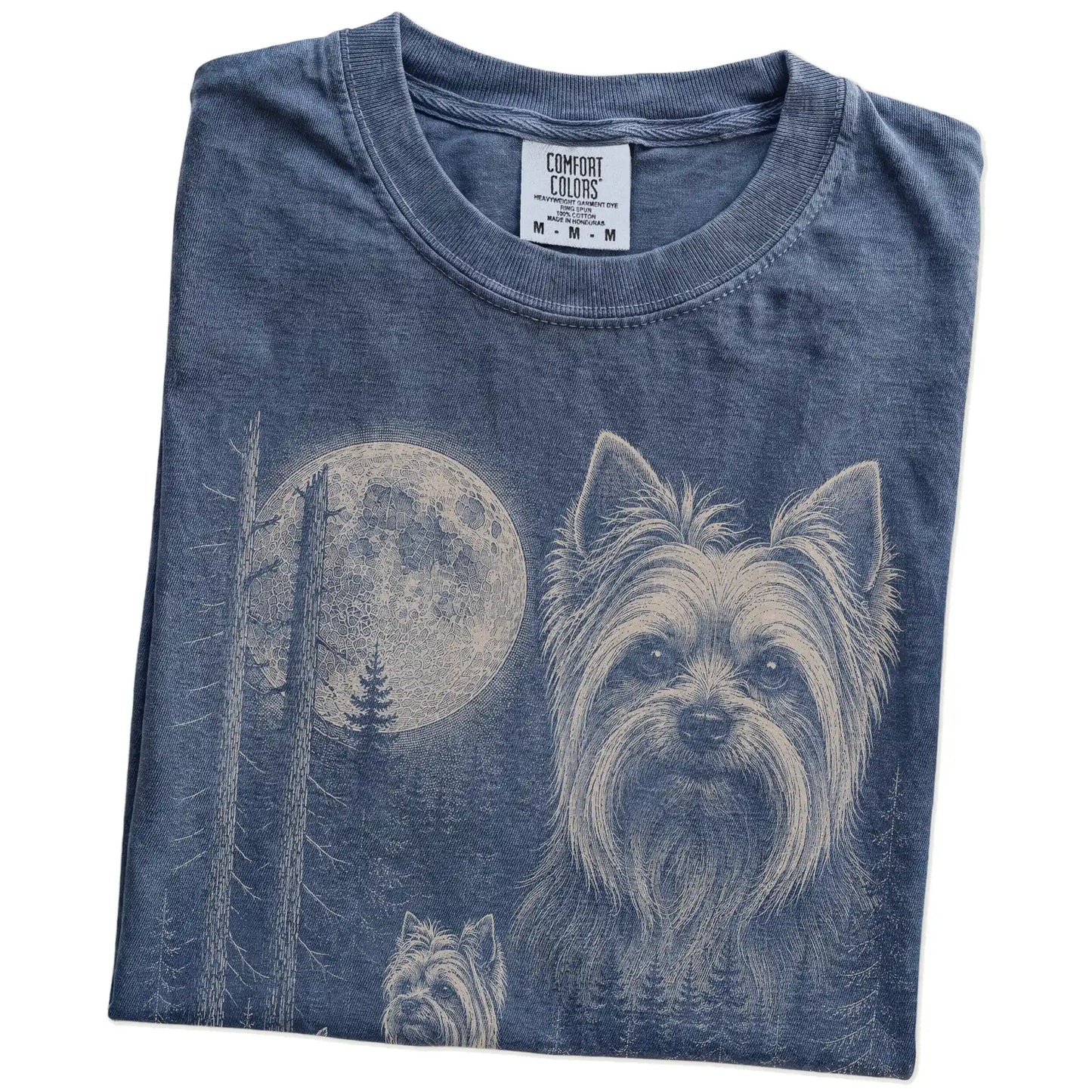 Folded Denim Yorkie Moonlit Forest T-Shirt showing the graphic
