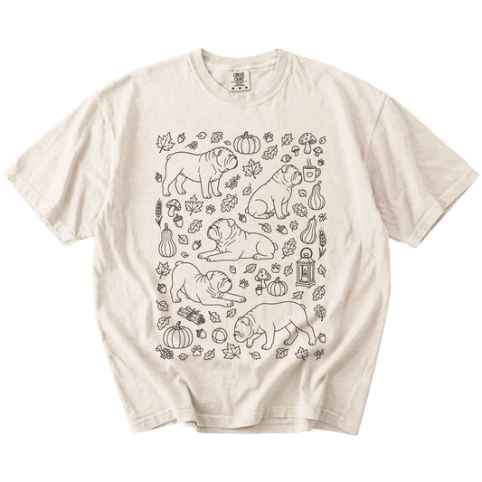 Bulldog dogs with pumpkins, leaves, acorns, and woodland details on a Ivory Comfort Colors® T-shirt