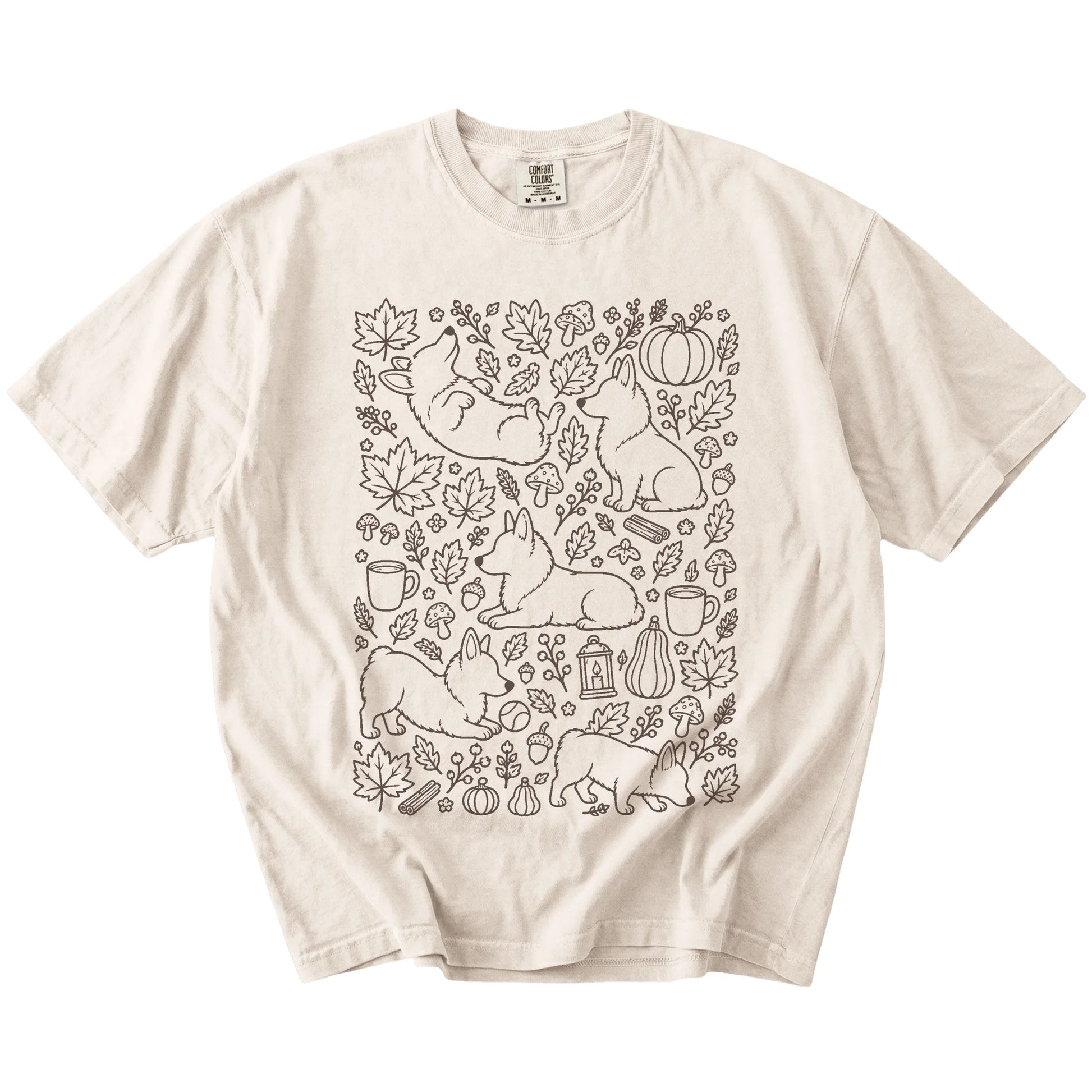Corgi dogs with pumpkins, leaves, acorns, and woodland details on a Ivory Comfort Colors® T-shirt