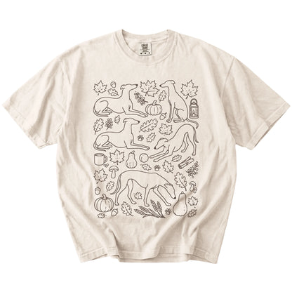 Greyhound dogs with pumpkins, leaves, acorns, and woodland details on a Ivory Comfort Colors® T-shirt