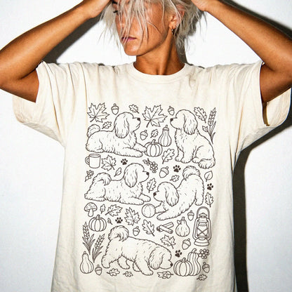 Model wearing a Ivory Comfort Colors® T-shirt with Havanese dogs with pumpkins, leaves, acorns, and woodland details