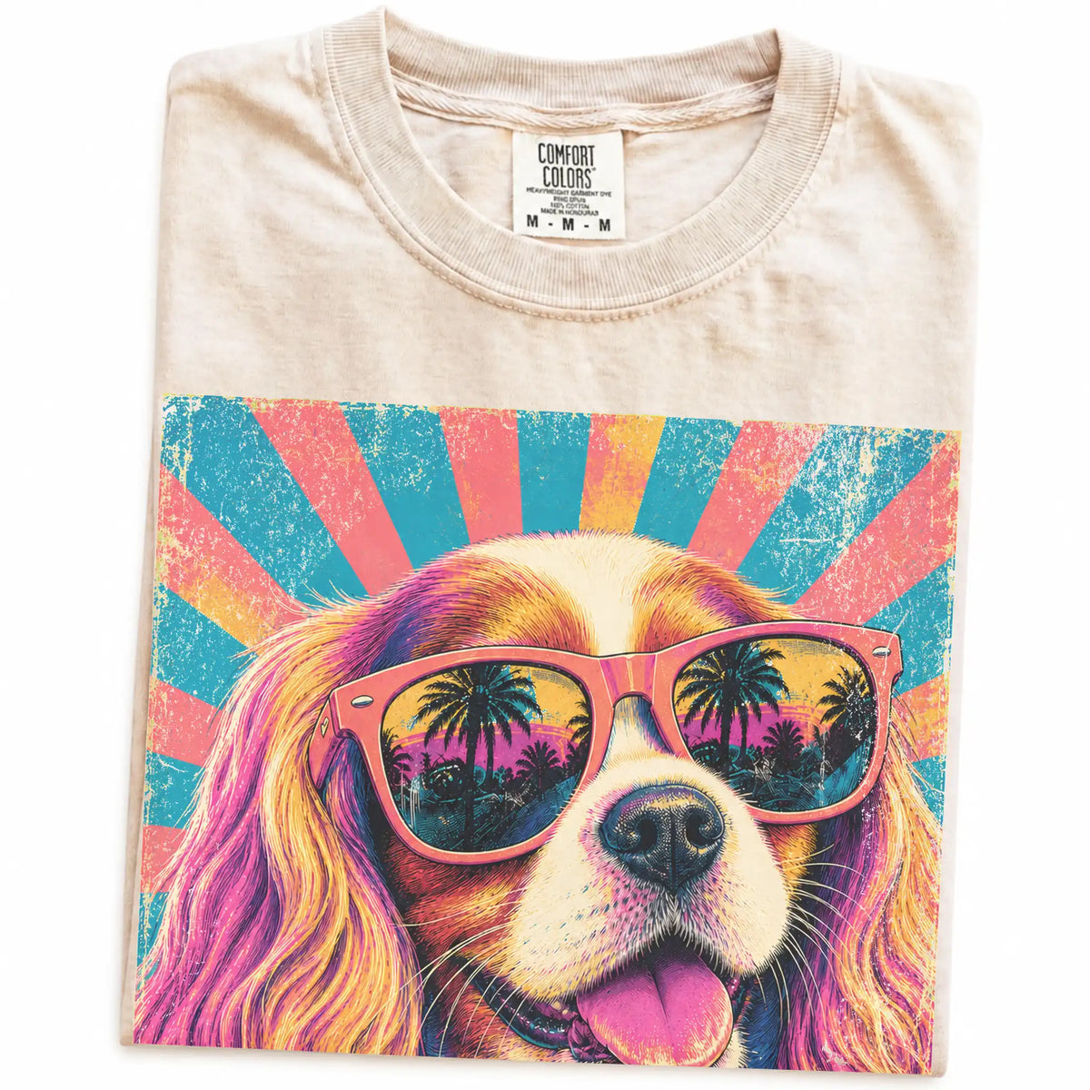 Retro Cavalier King Charles Spaniel Mama design on a Ivory Comfort Colors T-shirt folded detail