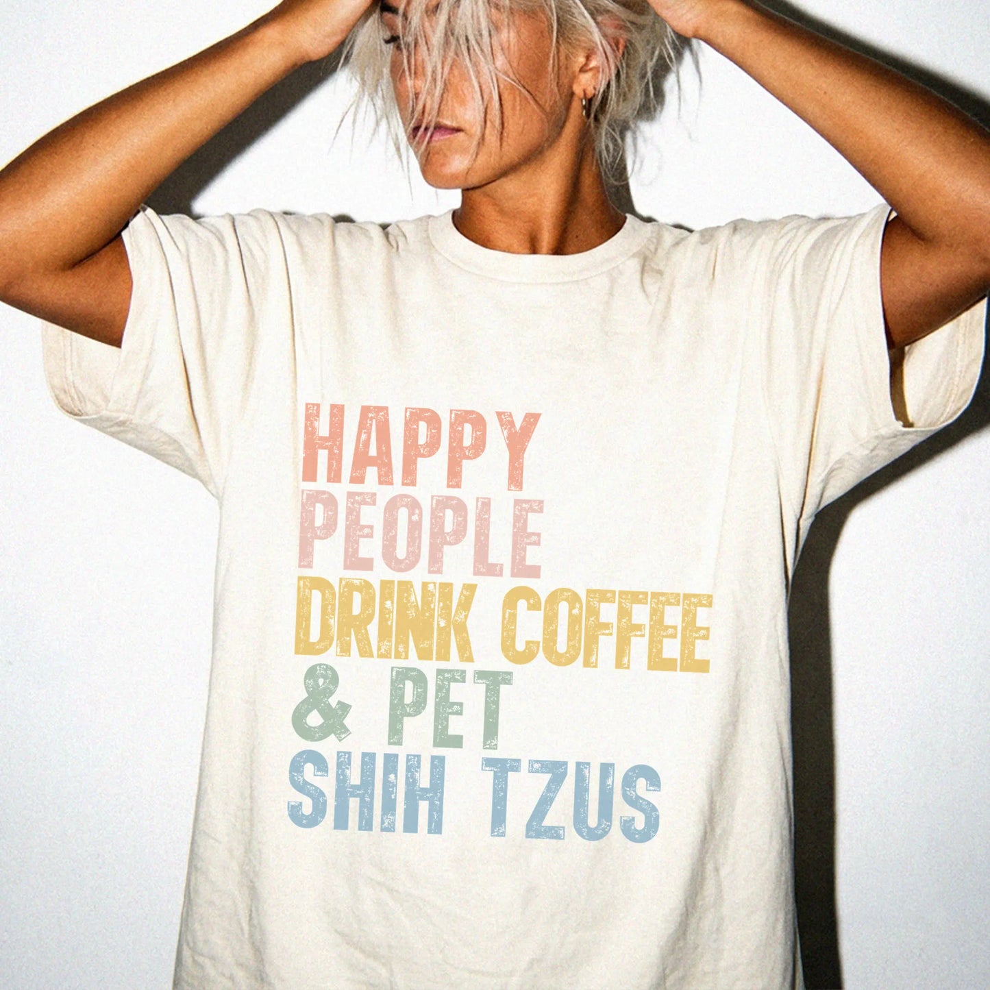 Model wearing a Ivory Comfort Colors® T-shirt featuring Shih Tzu with coffee and “Happy People Drink Coffee and Pet Dogs” let