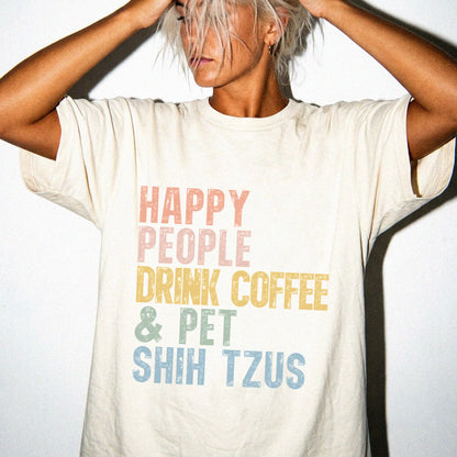 Model wearing a Ivory Comfort Colors® T-shirt featuring Shih Tzu with coffee and “Happy People Drink Coffee and Pet Dogs” let