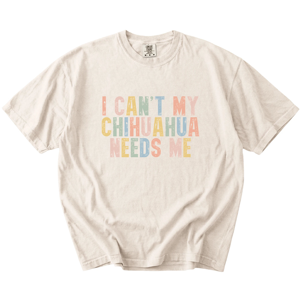 Chihuahua with “I Can’t, My Dog Needs Me” lettering on a Ivory Comfort Colors® T-shirt