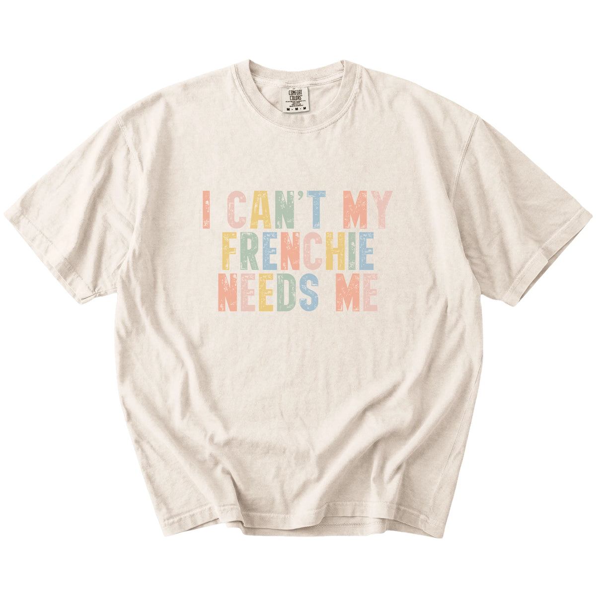 French Bulldog with “I Can’t, My Dog Needs Me” lettering on a Ivory Comfort Colors® T-shirt