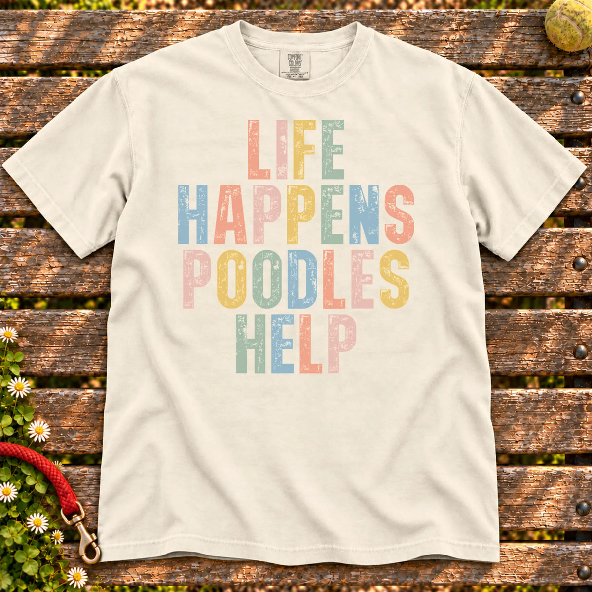 Poodle making hard days better with “Life Happens, Dogs Help” lettering on a Ivory Comfort Colors® T-shirt