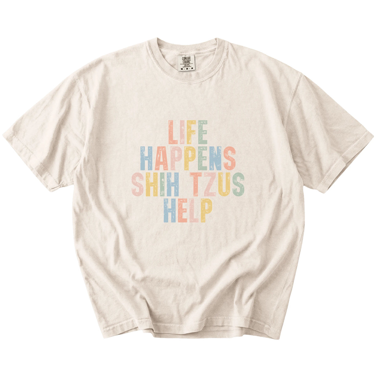 retro “Life Happens, Shih Tzus Help” lettering on a Ivory Comfort Colors® T-shirt