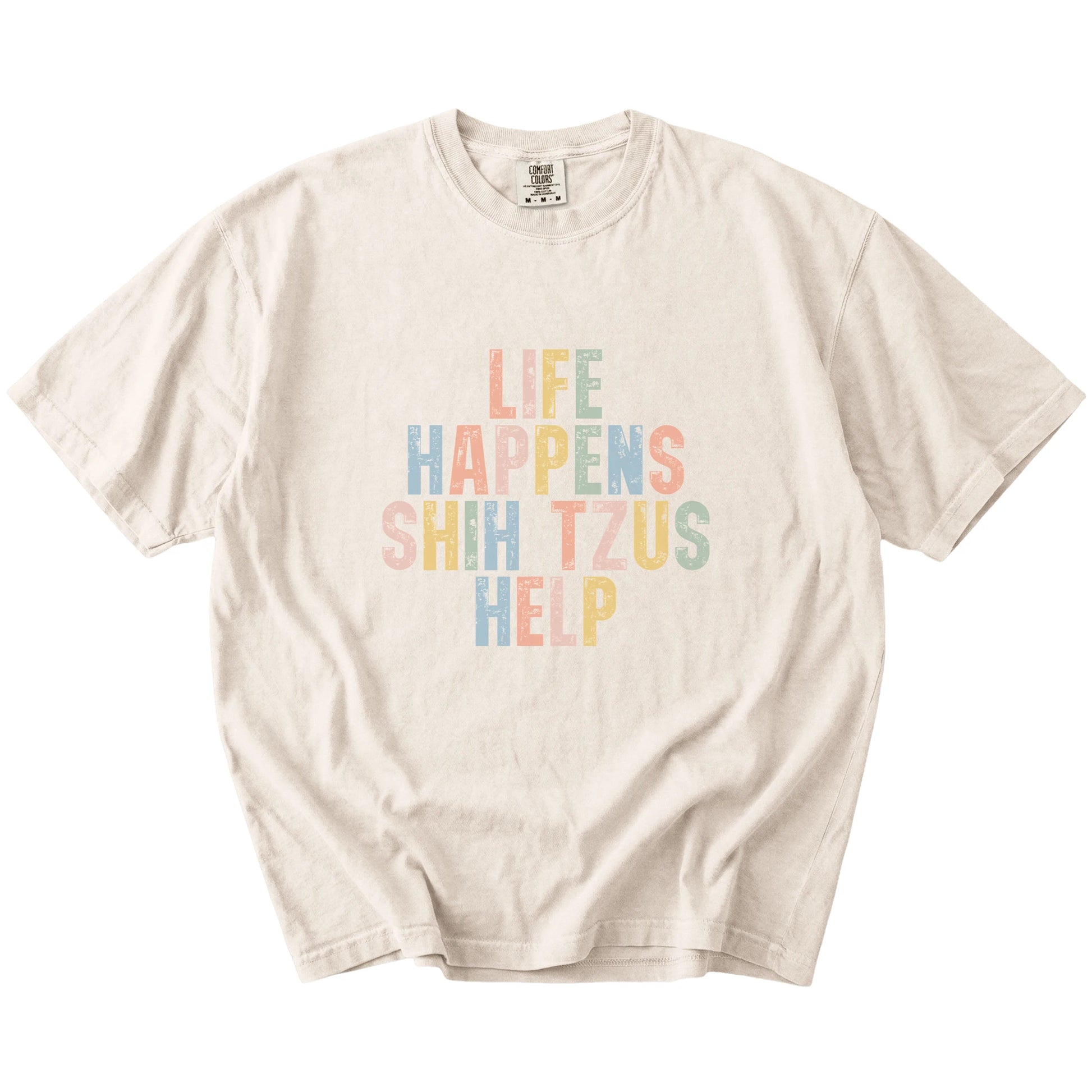 retro “Life Happens, Shih Tzus Help” lettering on a Ivory Comfort Colors® T-shirt