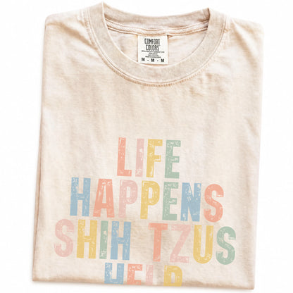 Folded Ivory Comfort Colors® T-shirt showing retro “Life Happens, Shih Tzus Help” lettering