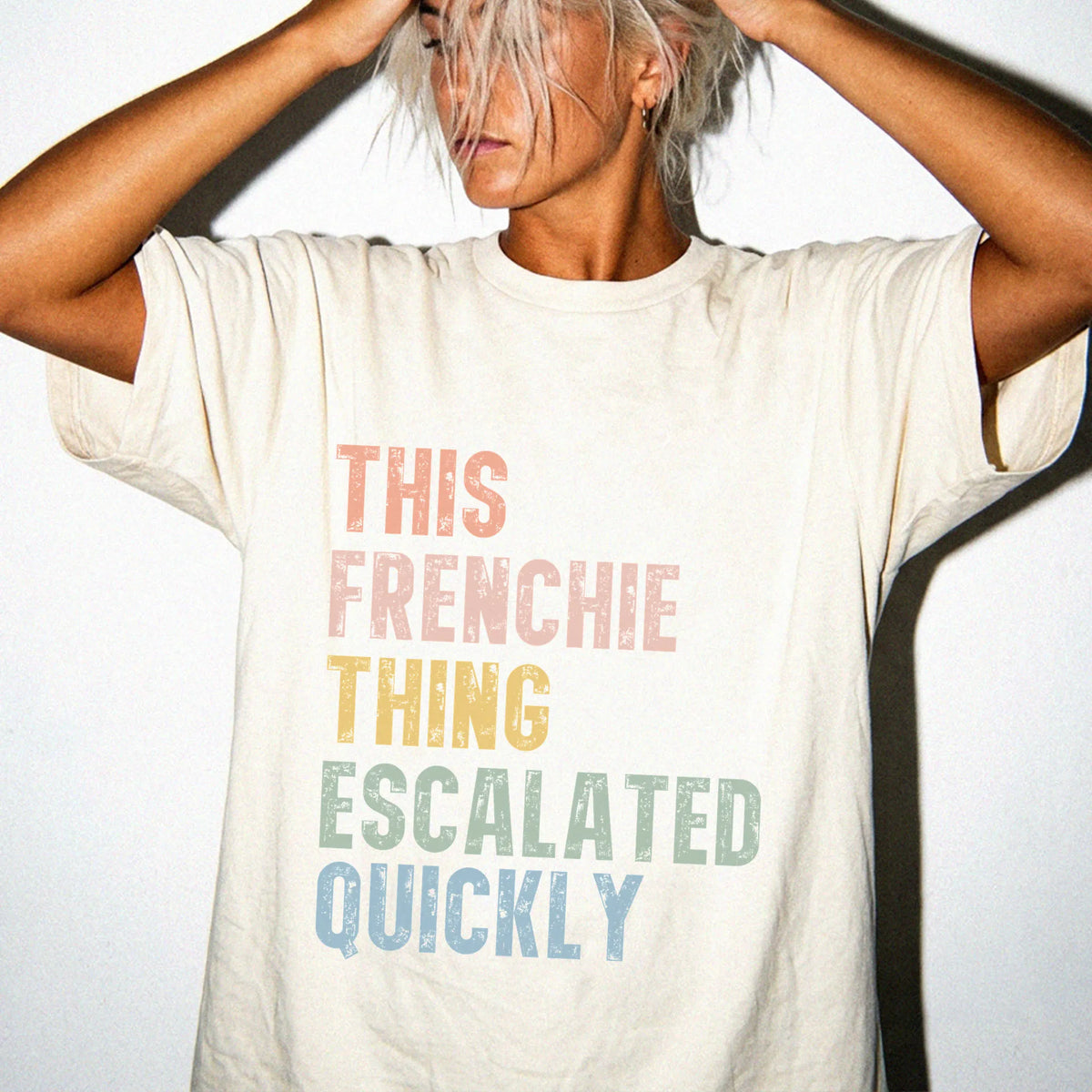 Model wearing a Ivory Comfort Colors® T-shirt with retro “This French Bulldog Thing Escalated Quickly” lettering