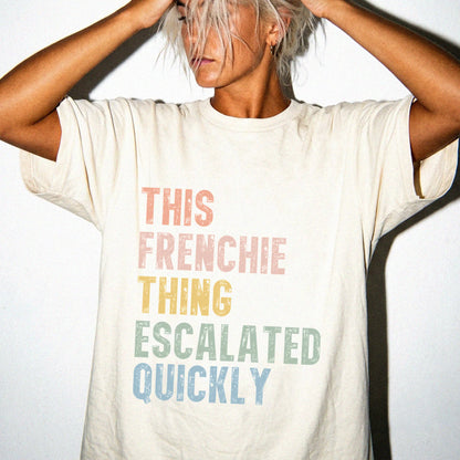 Model wearing a Ivory Comfort Colors® T-shirt with retro “This French Bulldog Thing Escalated Quickly” lettering