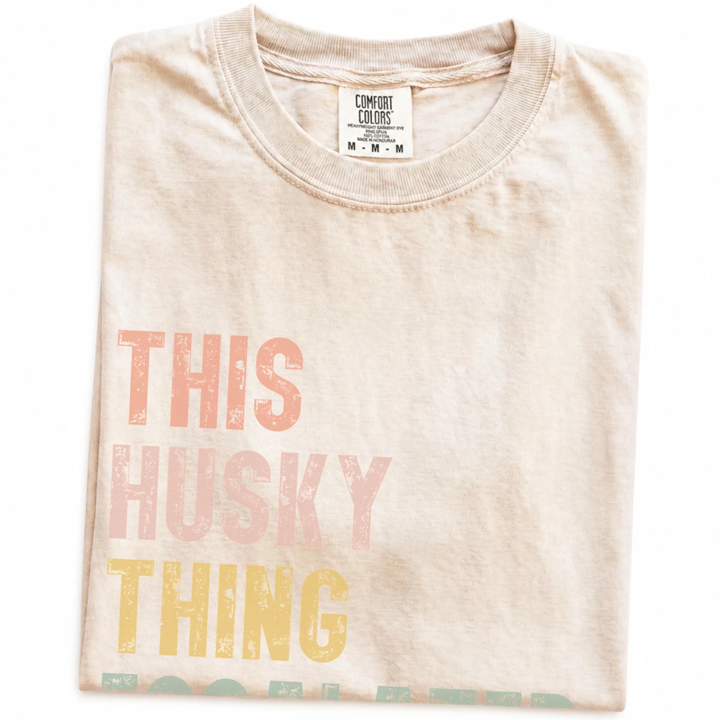 Folded Ivory Comfort Colors® T-shirt showing retro “This Husky Thing Escalated Quickly” lettering