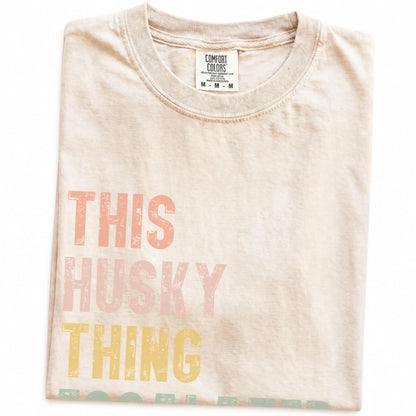 Folded Ivory Comfort Colors® T-shirt showing retro “This Husky Thing Escalated Quickly” lettering
