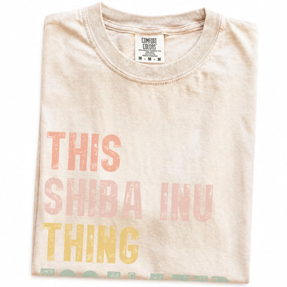 Folded Ivory Comfort Colors® T-shirt showing retro “This Shiba Inu Thing Escalated Quickly” lettering