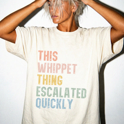 Model wearing a Ivory Comfort Colors® T-shirt with retro “This Whippet Thing Escalated Quickly” lettering