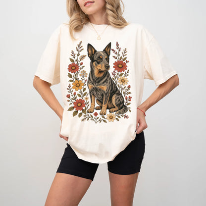 Model wearing an Ivory Comfort Colors® T-shirt showing Blue Heeler portrait surrounded by wildflowers beneath the moon