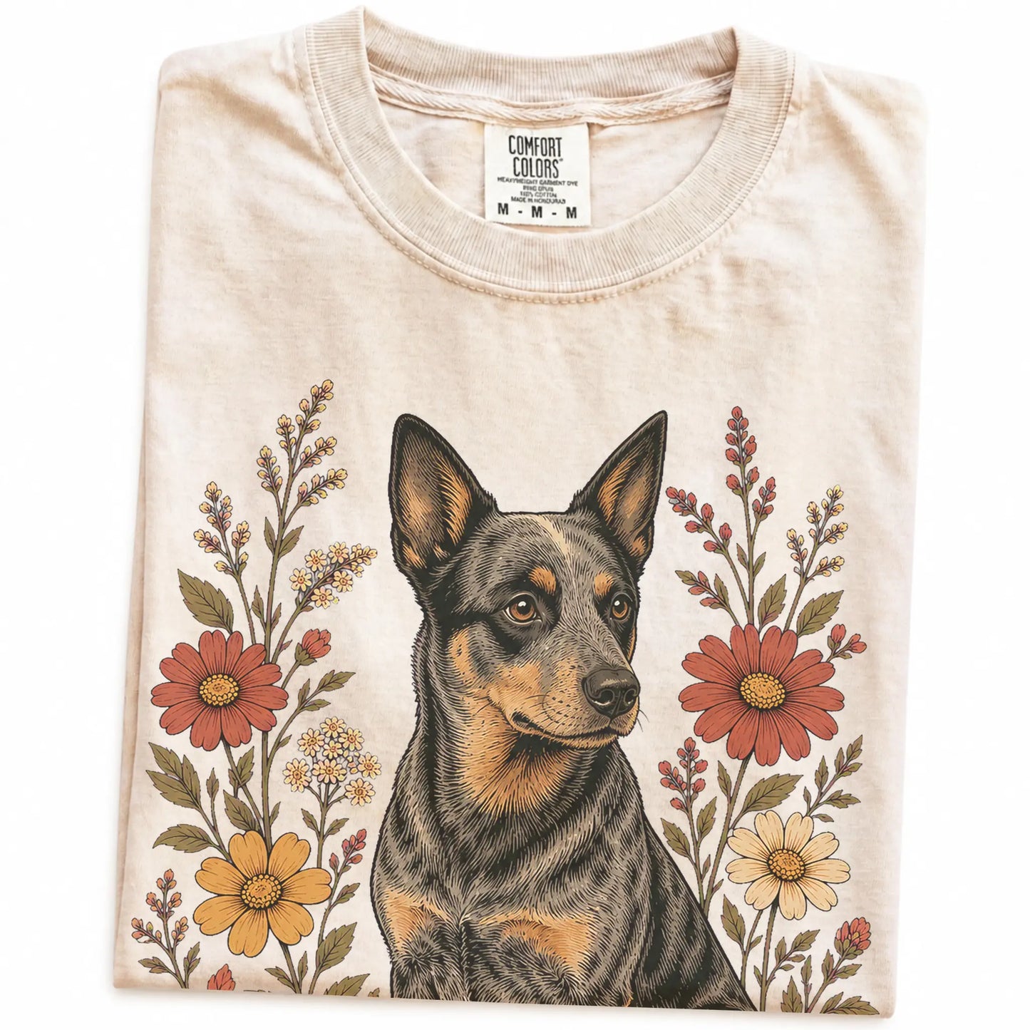 Folded Ivory Comfort Colors® T-shirt showing Blue Heeler portrait surrounded by wildflowers beneath the moon
