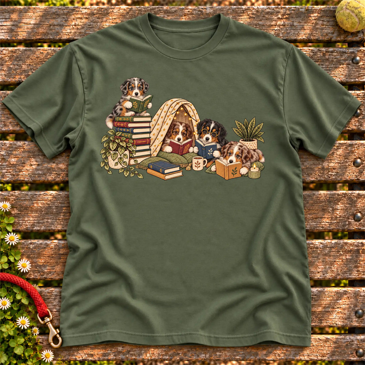 Australian Shepherd puppies reading books in a cozy blanket fort on a Military Green T-shirt