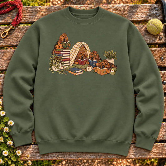 Bloodhound puppies reading books in a cozy blanket fort on a Military Green sweatshirt