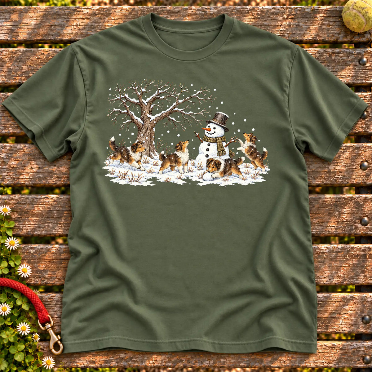 Collie puppies playing in snow with a snowman on a Military Green T-shirt