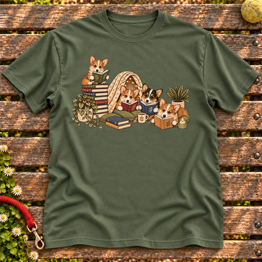 Corgi puppies reading books in a cozy blanket fort on a Military Green T-shirt
