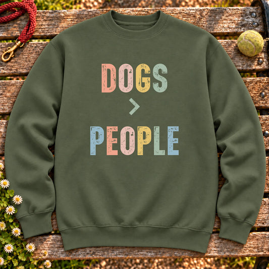 Dogss greater than people text design on a Military Green crewneck sweatshirt