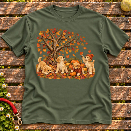 Four Golden Retriever puppies with pumpkins beneath an autumn tree on a Military Green softstyle T-shirt
