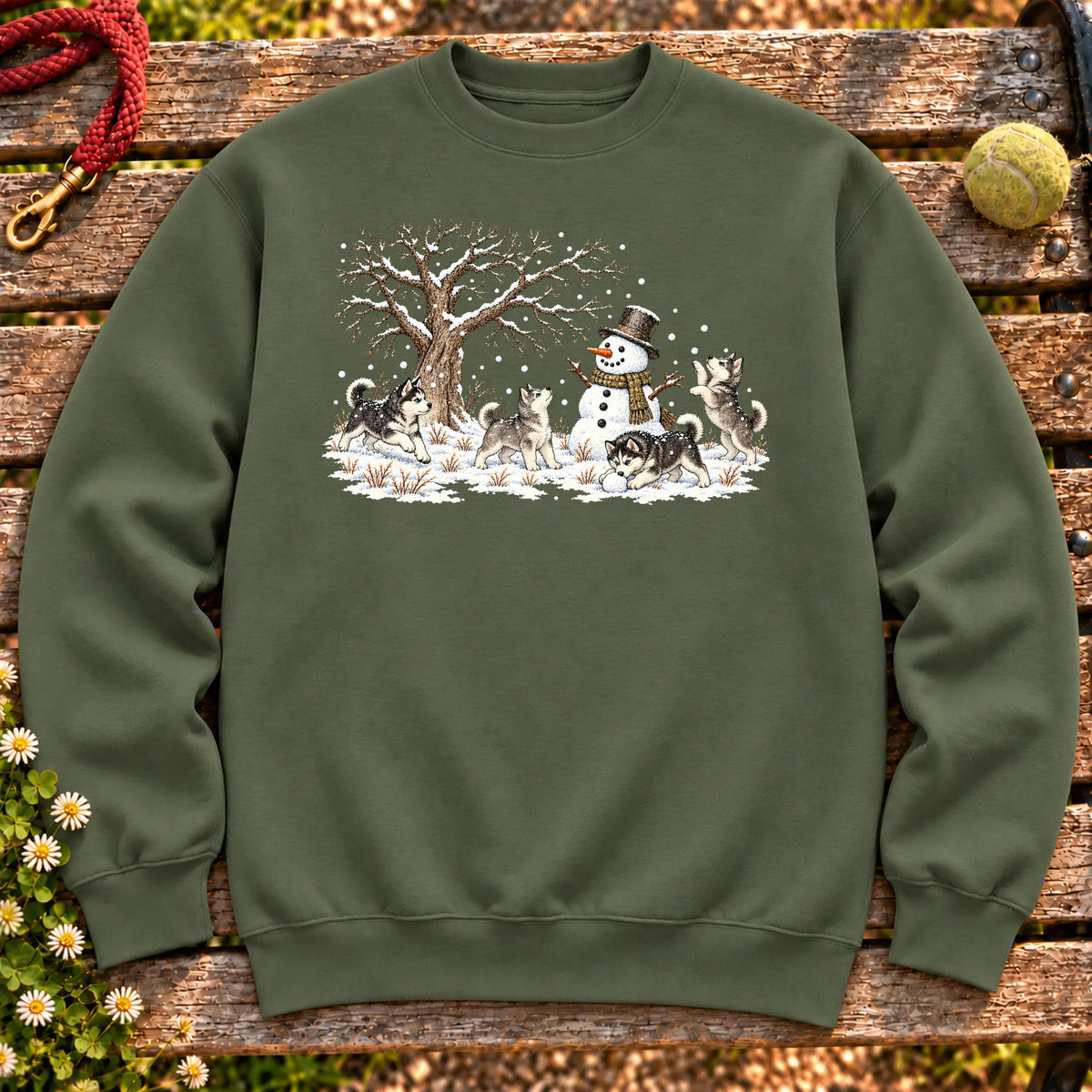 Husky puppies playing in snow with a snowman on a Military Green sweatshirt