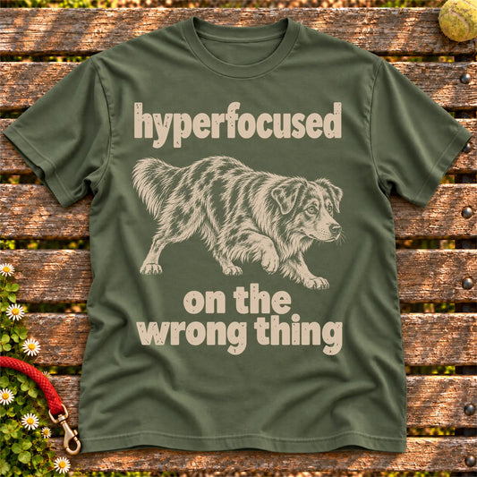 Military Green T-shirt with Australian Shepherd “hyperfocused on the wrong thing” design