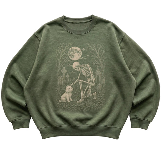 Skeleton petting a Bichon Frise in a graveyard on a Military Green sweatshirt