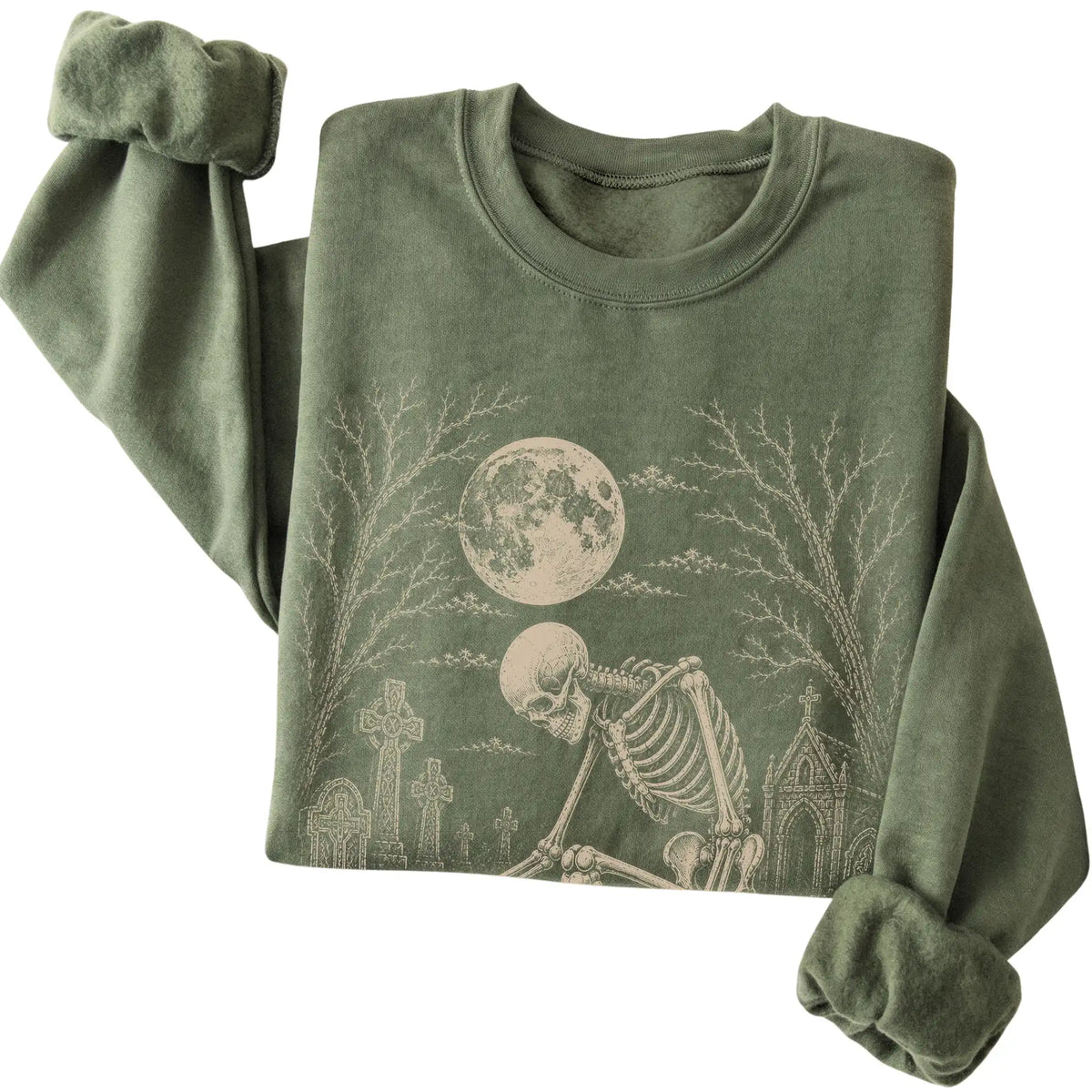Folded Military Green sweatshirt with a skeleton petting a Bichon Frise in a graveyard