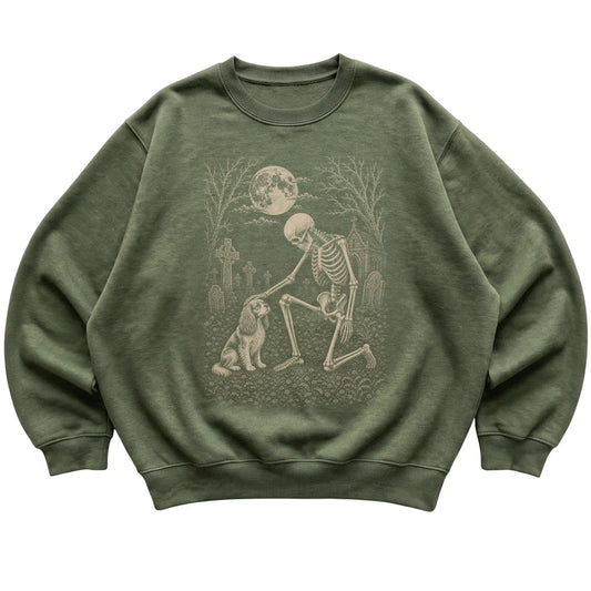 Skeleton petting a Cavalier in a graveyard on a Military Green sweatshirt