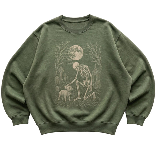 Skeleton petting a French Bulldog in a graveyard on a Military Green sweatshirt
