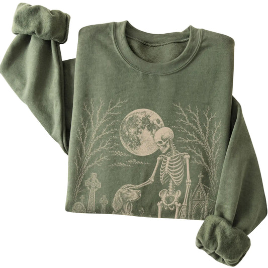 Folded Military Green sweatshirt with a skeleton petting an Irish Setter in a graveyard