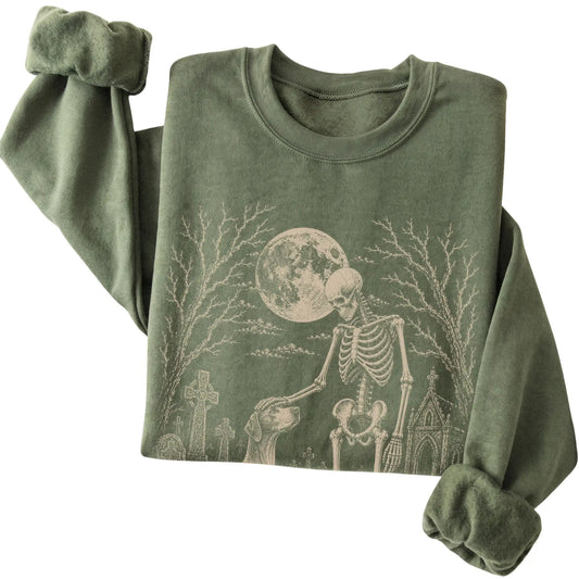 Folded Military Green sweatshirt with a skeleton petting a Pointer in a graveyard