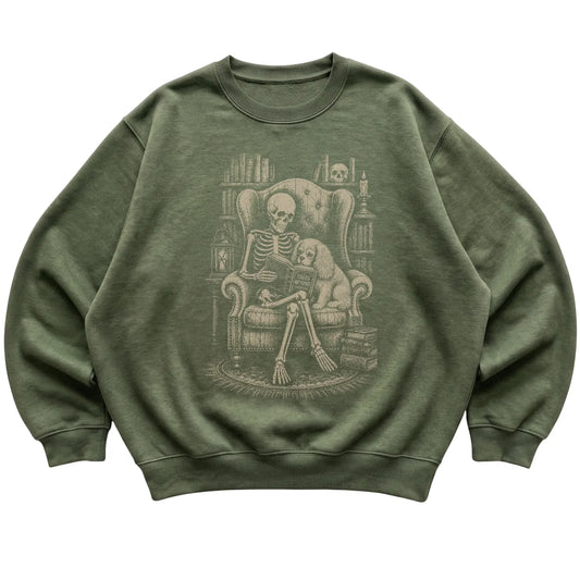 Skeleton reading Tales Beyond to a Cavalier on a Military Green sweatshirt