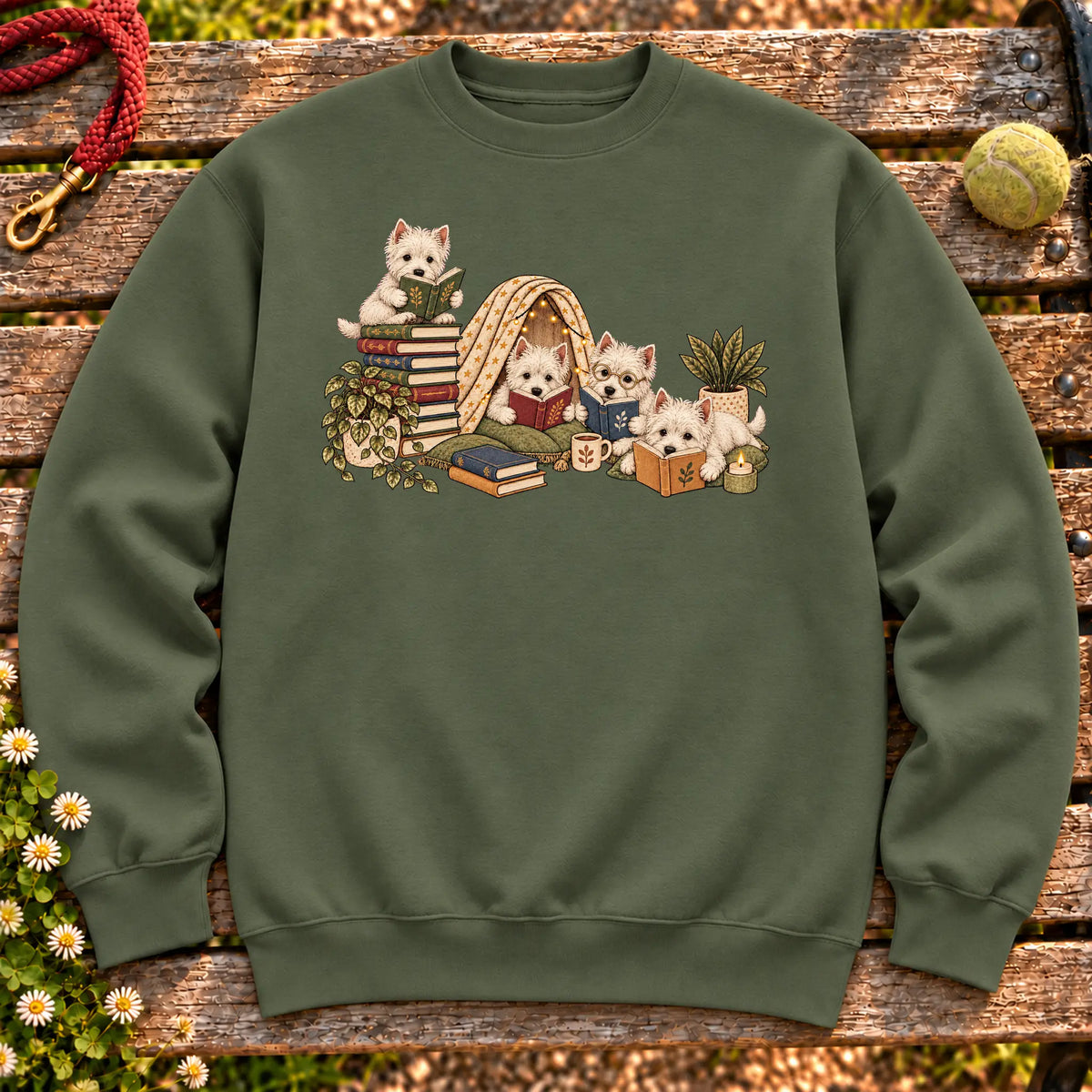 Westie puppies reading books in a cozy blanket fort on a Military Green sweatshirt