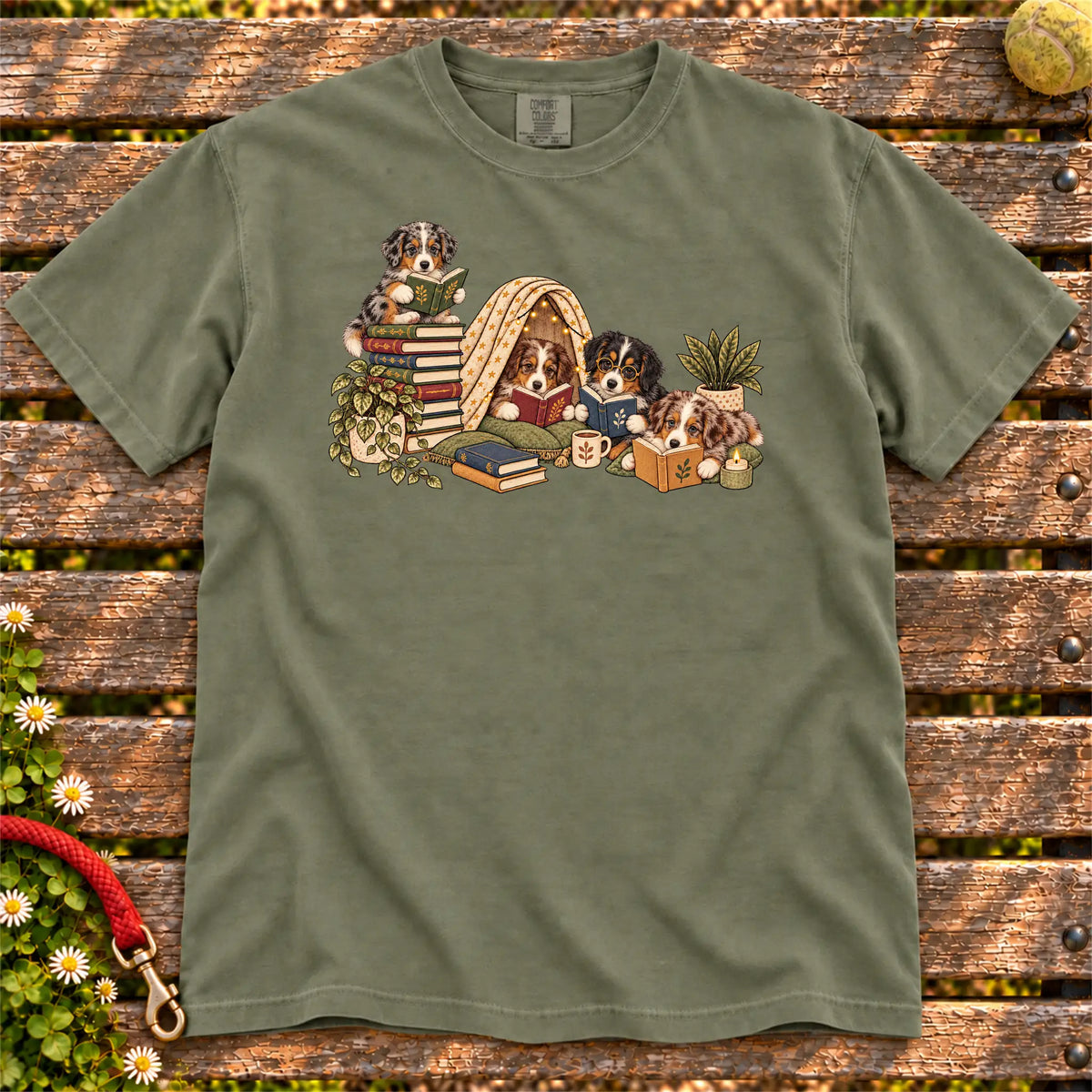 Australian Shepherd puppies reading books in a cozy blanket fort on a Moss T-shirt
