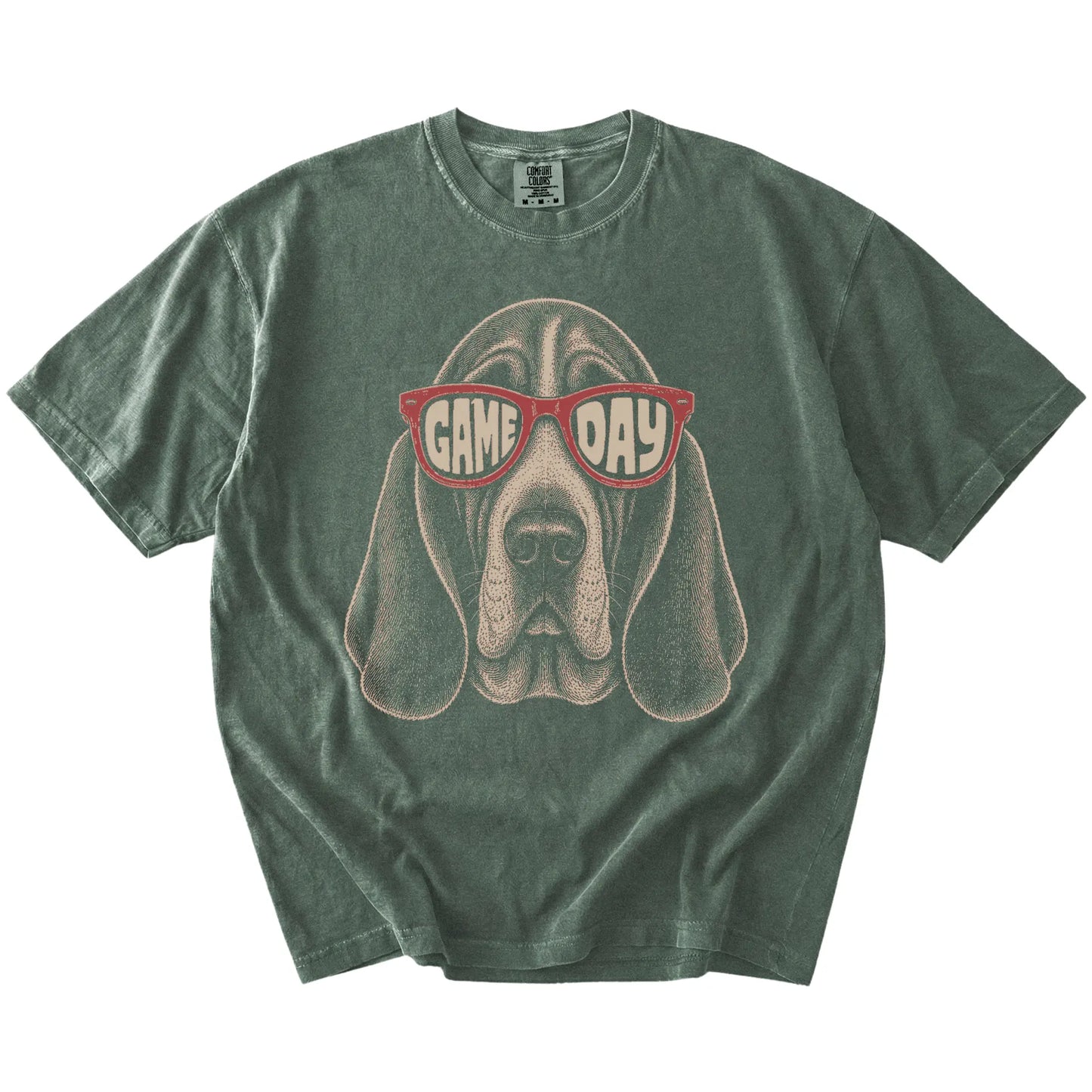 Basset Hound wearing red Game Day sunglasses on a Moss Comfort Colors® T-shirt