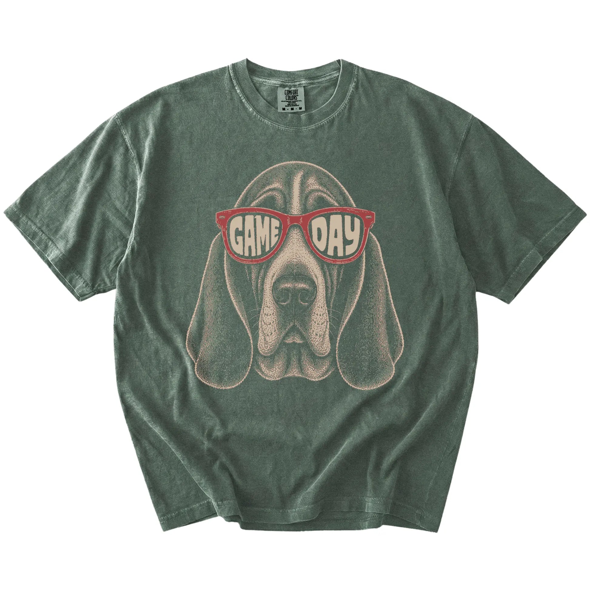 Basset Hound wearing red Game Day sunglasses on a Moss Comfort Colors® T-shirt
