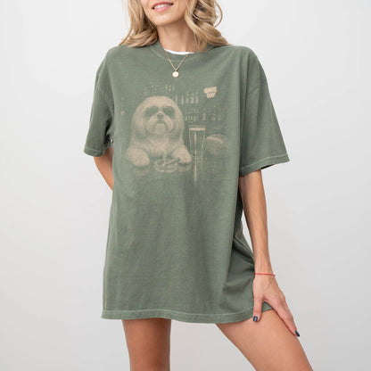 Model wearing a Moss Comfort Colors® T-shirt featuring Shih Tzu with beer and football graphics