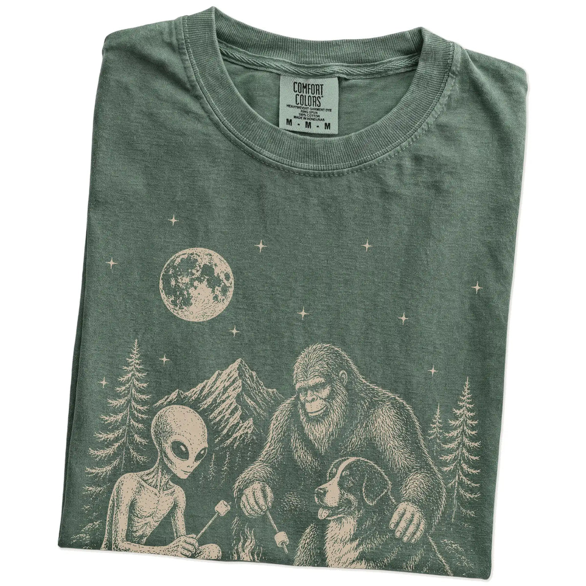 Folded Moss Comfort Colors® T-shirt showing Bernese Mountain Dog camping with Bigfoot and an alien