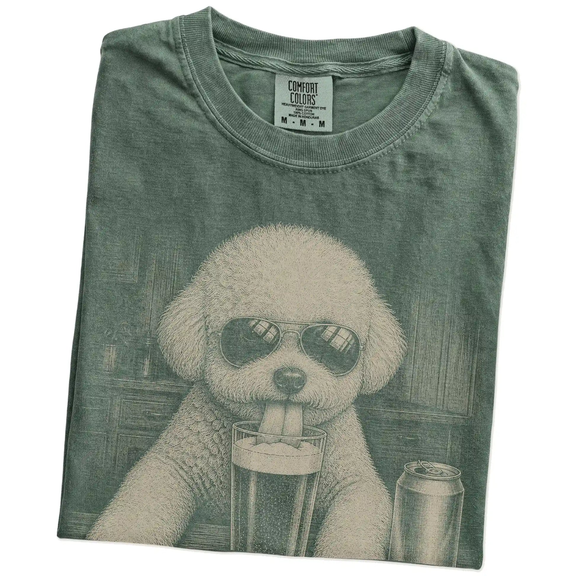 Folded Moss Comfort Colors® t-shirt showing Bichon Frise sneaking a drink from a pint