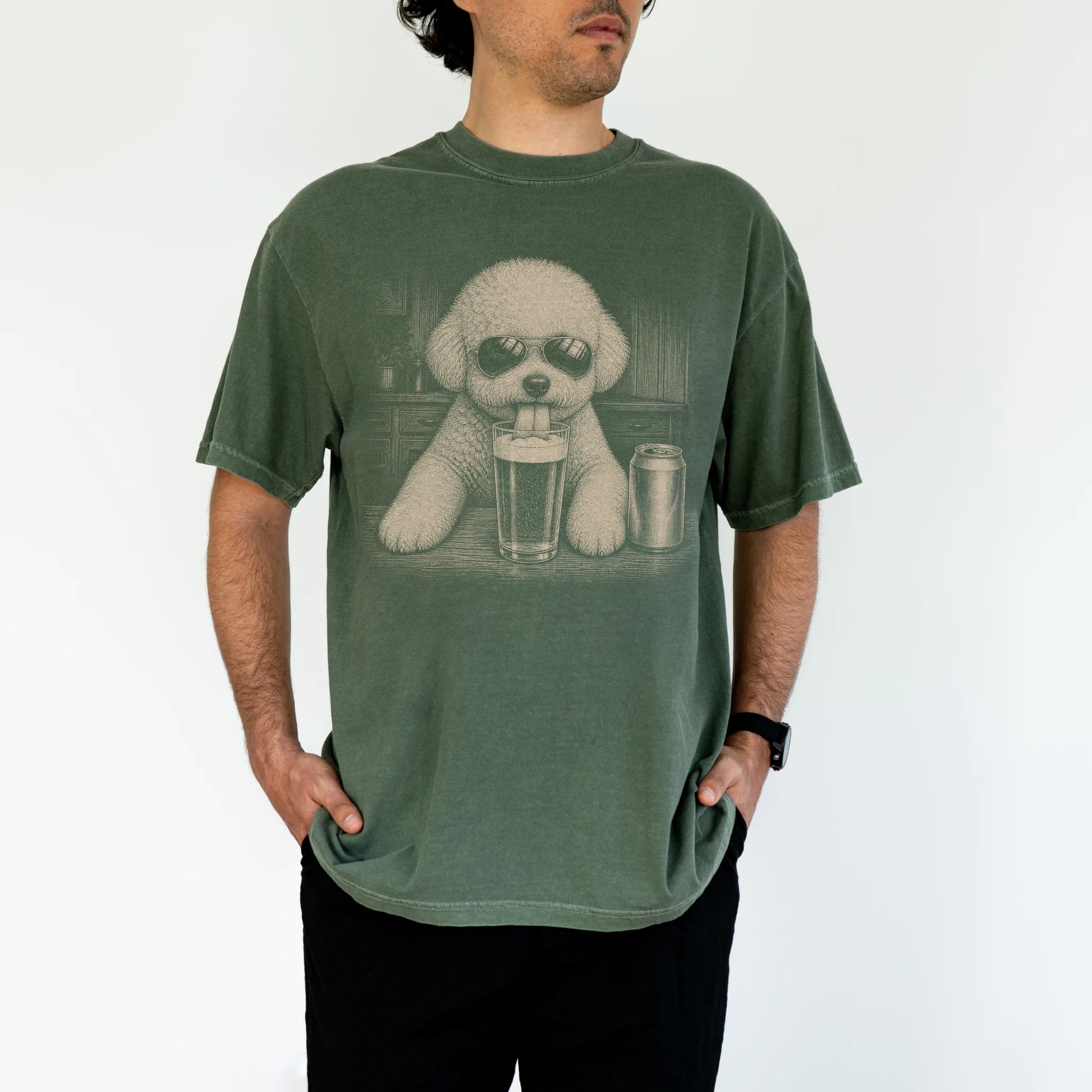 Model wearing a Moss Comfort Colors® t-shirt with Bichon Frise sneaking a drink from a pint