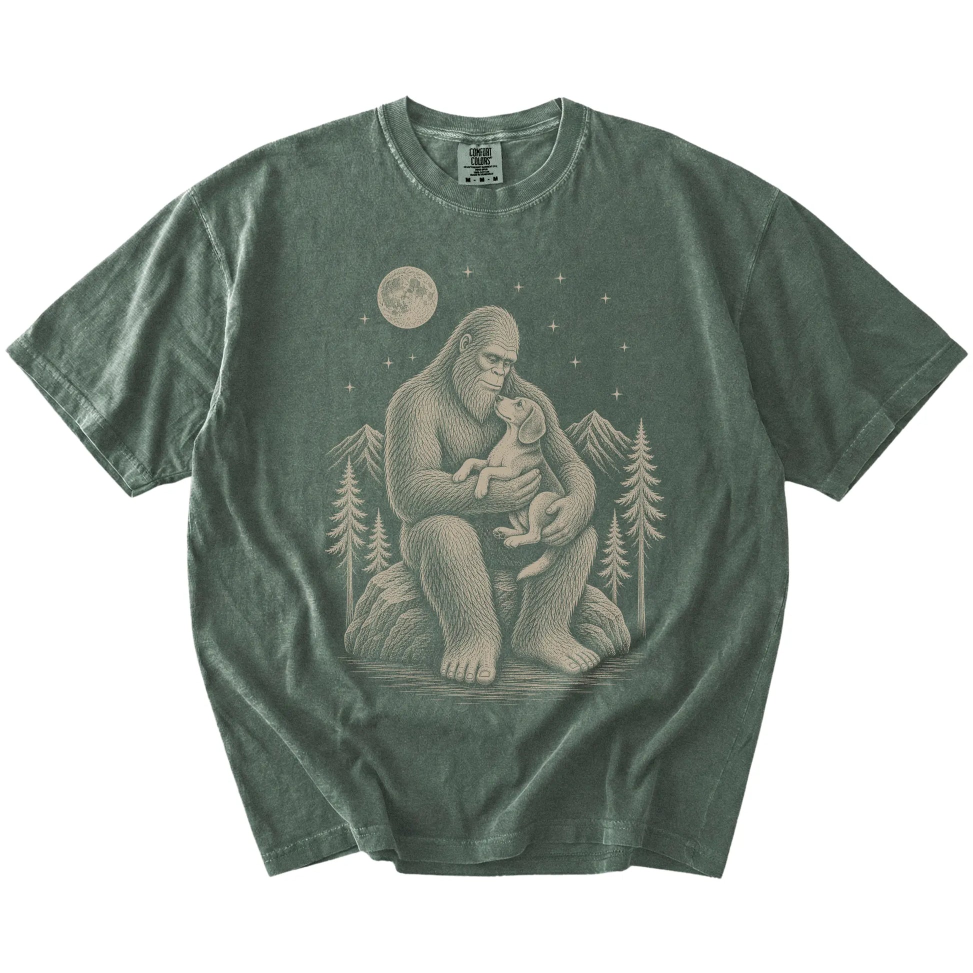 Bigfoot holding a Beagle on a Moss Comfort Colors® T-shirt