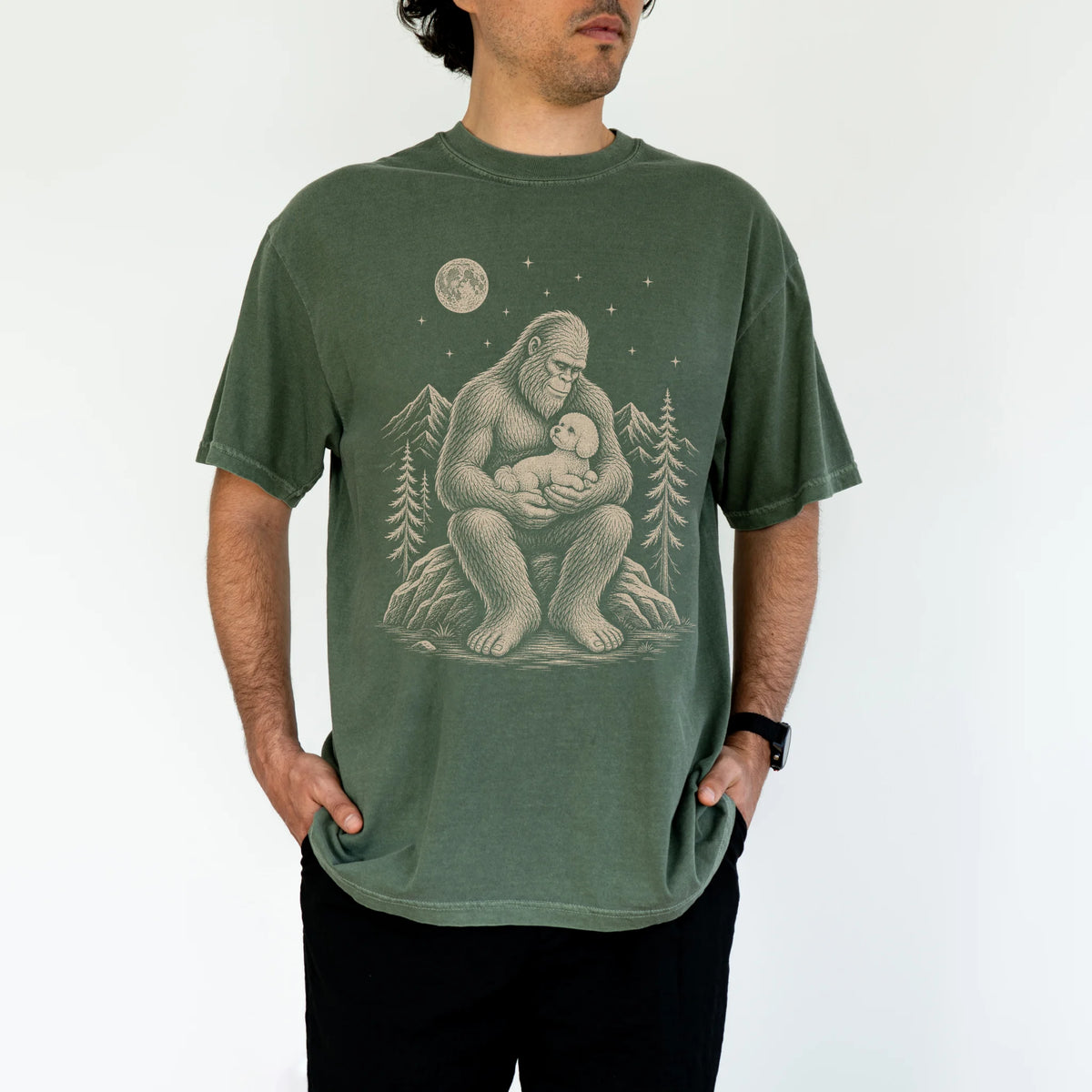 Person wearing the Bigfoot and Bichon Frise T-Shirt in Moss