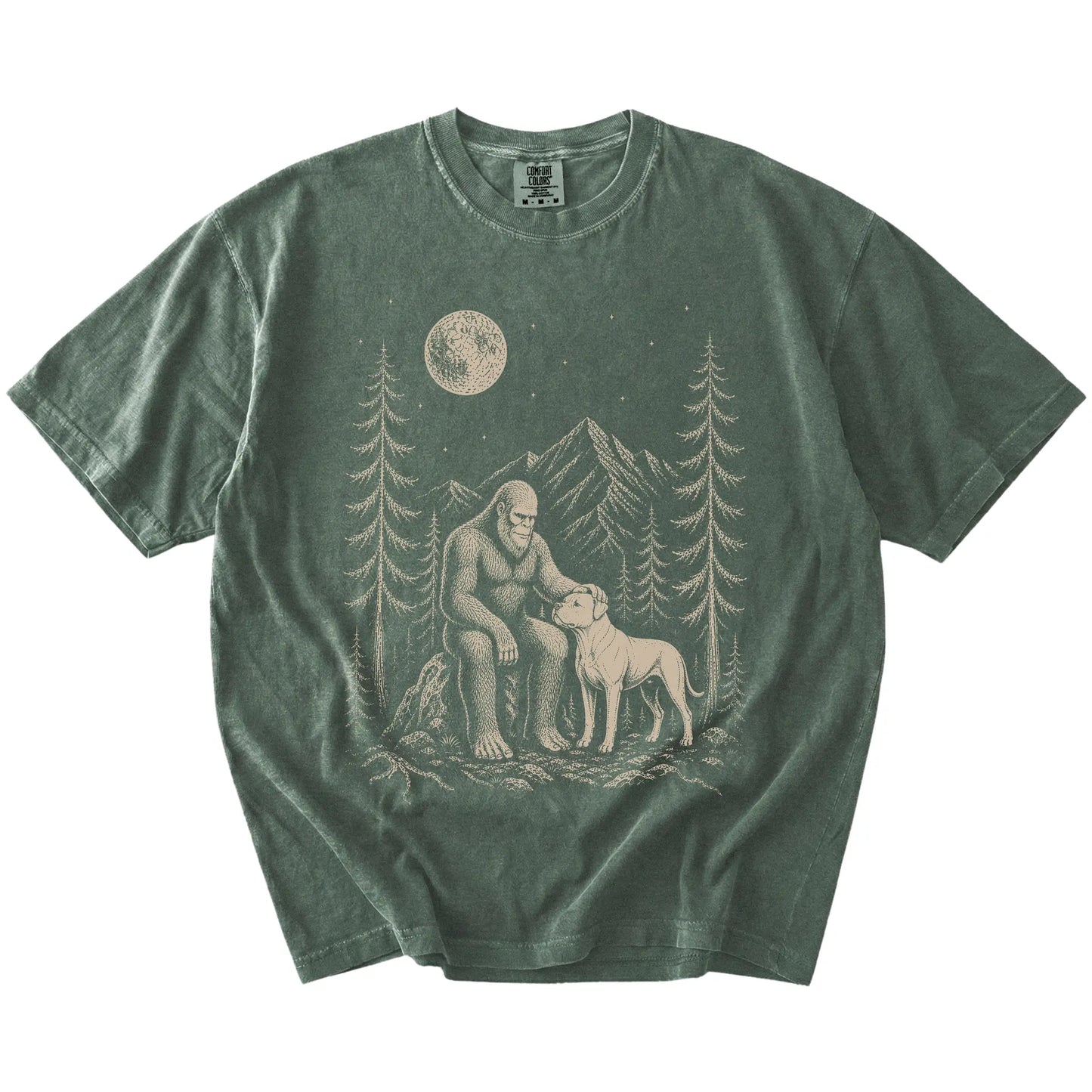 Bigfoot petting a American Bulldog beneath the moon in a pine forest on a Moss Comfort Colors® T-shirt